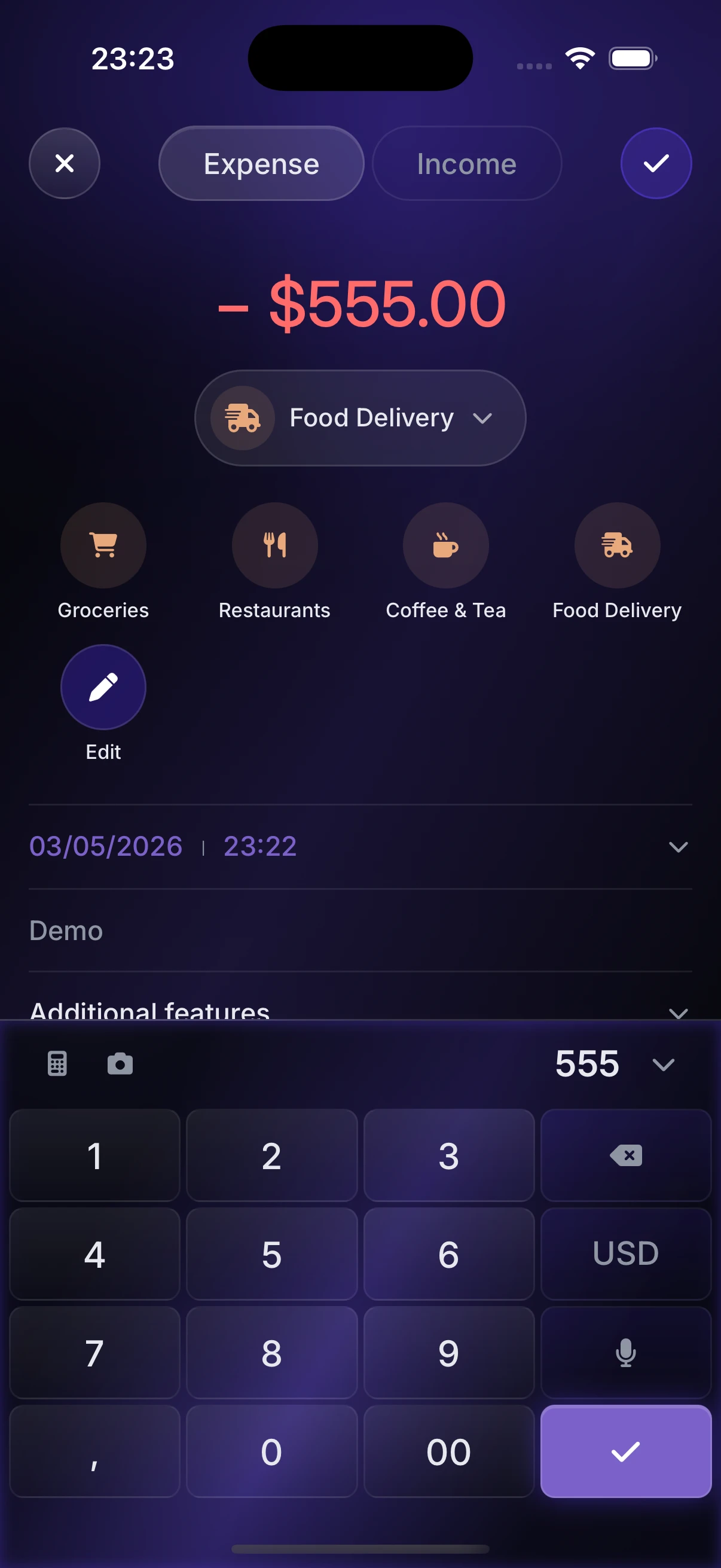 The Manilo add-transaction screen with a $555 expense being voice-logged